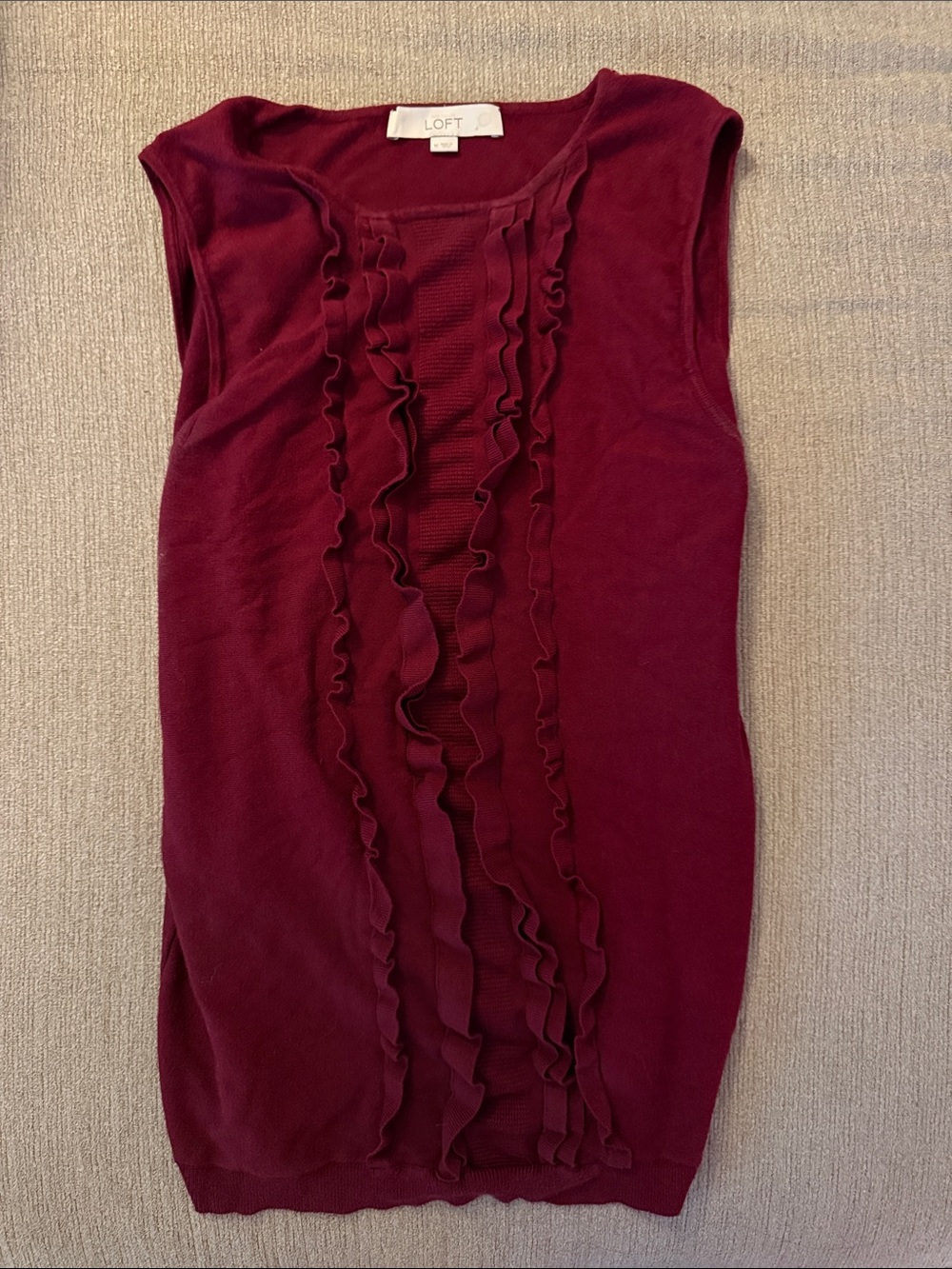 The LOFT Sleeveless Sweater Fall Burgundy with Front Ruffle Pleat.
